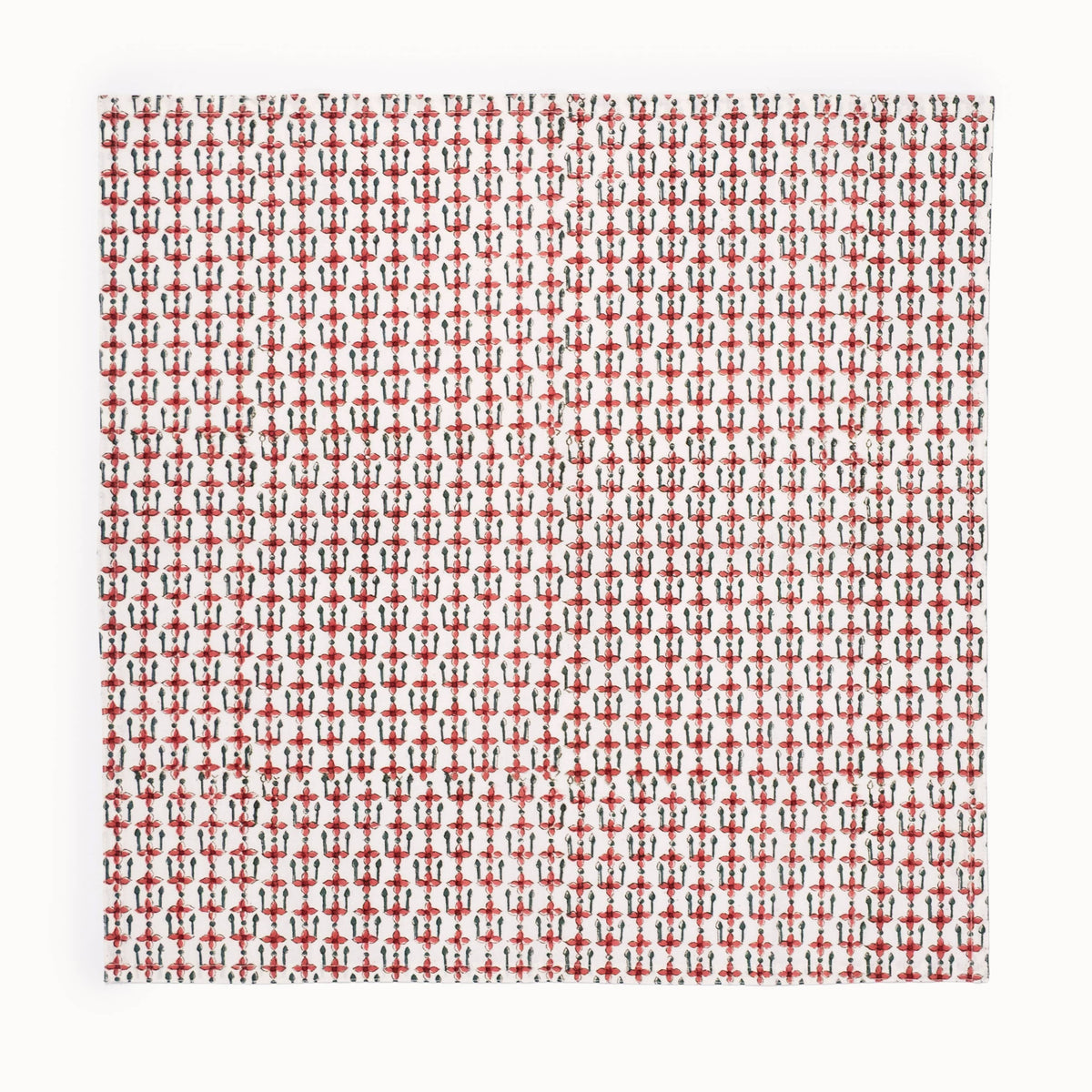 A square textile sample with a dense repeating pattern of small red and black geometric motifs on a white base, shown against a plain white background.