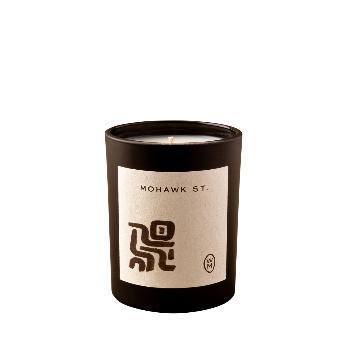 Candle with 'Mohawk St.' label on a white background
