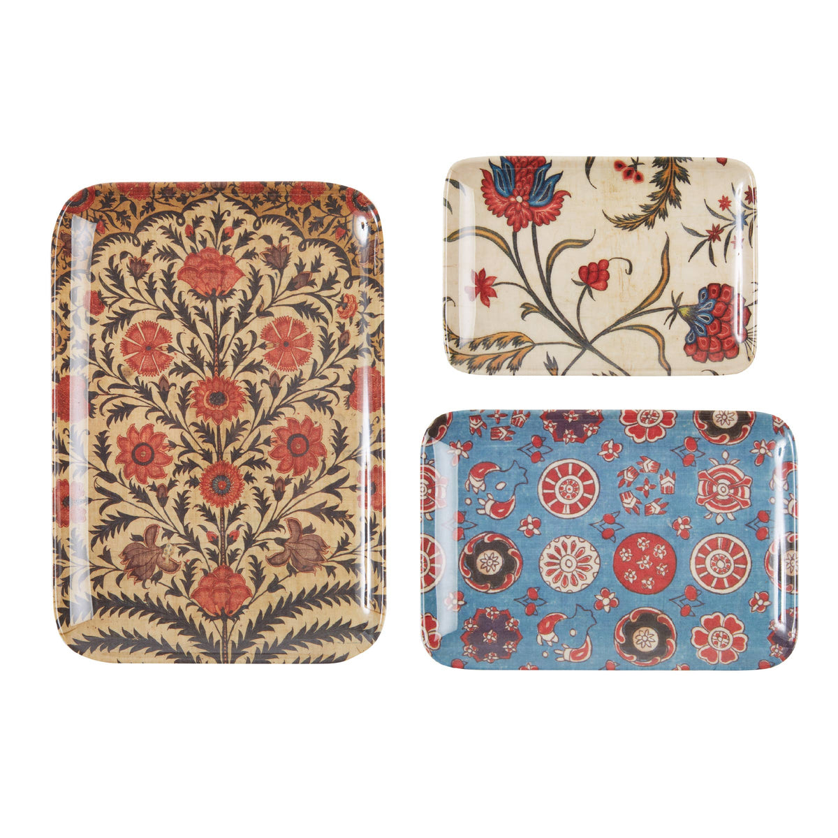 Three decorative trays with floral patterns on a white background