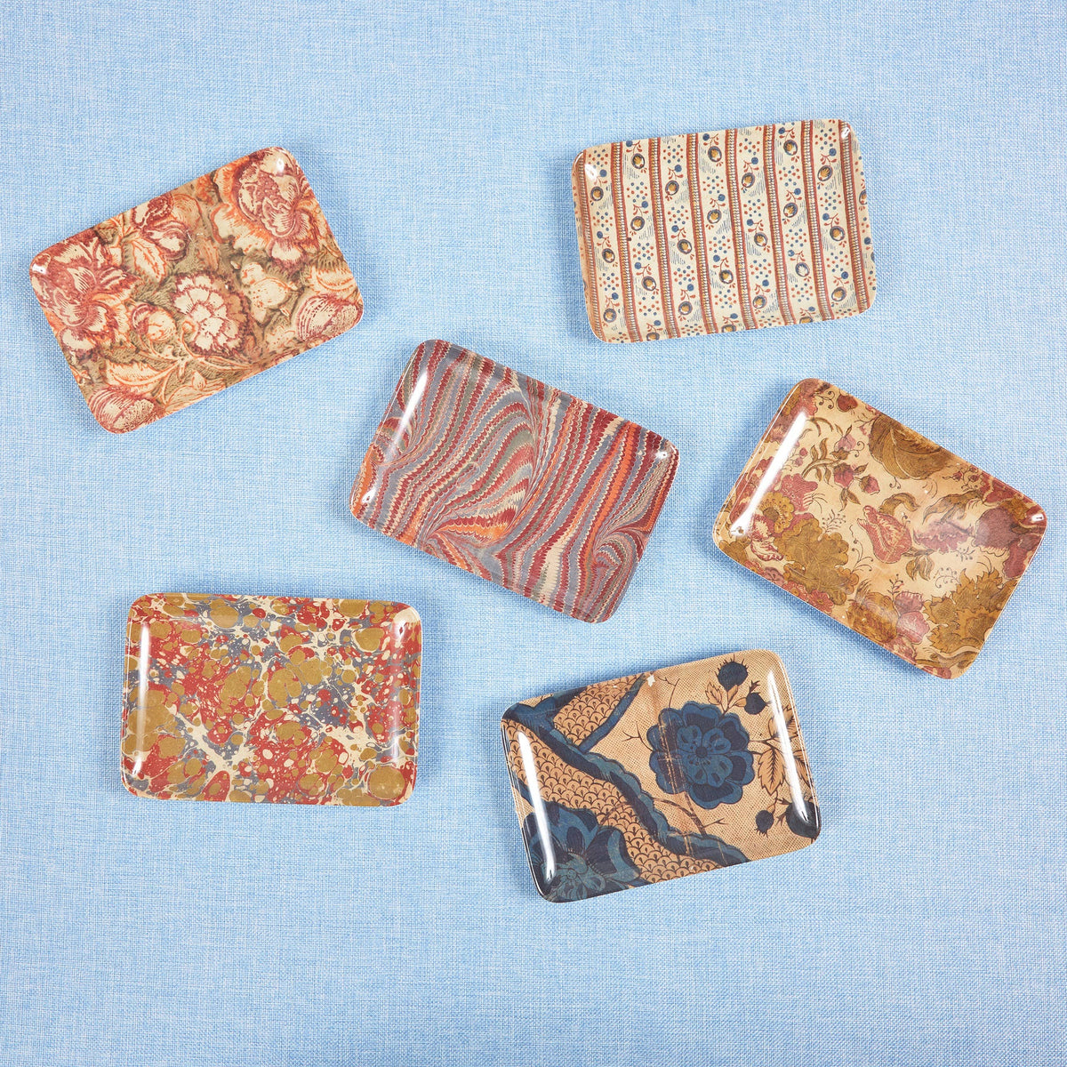 Set of marbled rectangular stones on a light blue background