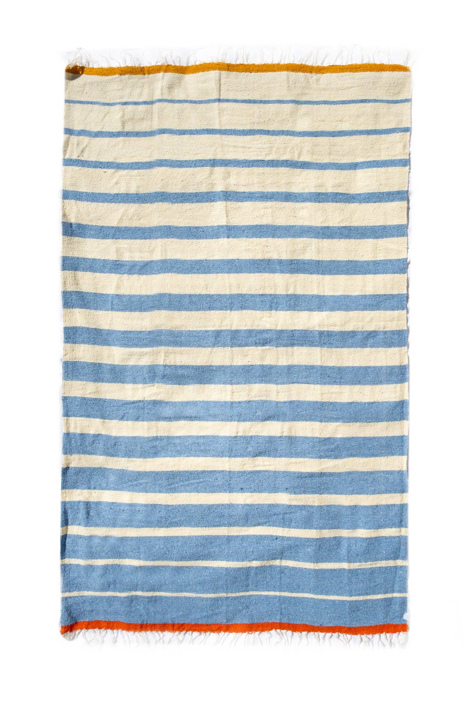 Striped towel with blue and white stripes on a white background