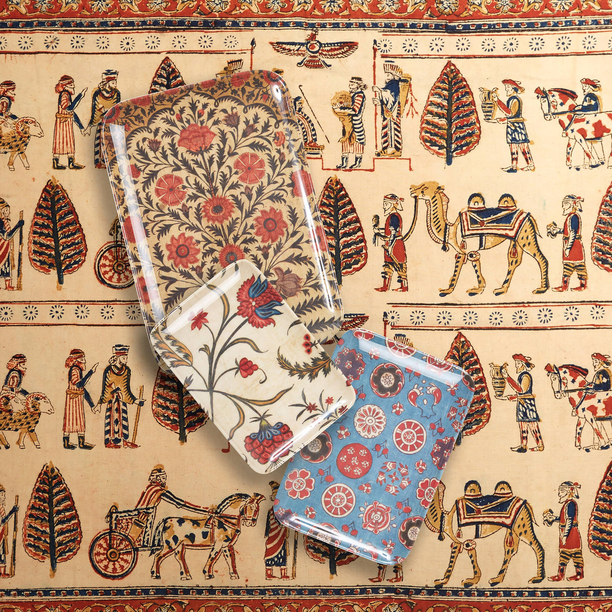 Patterned trays on a decorative background with intricate patterns and figures.