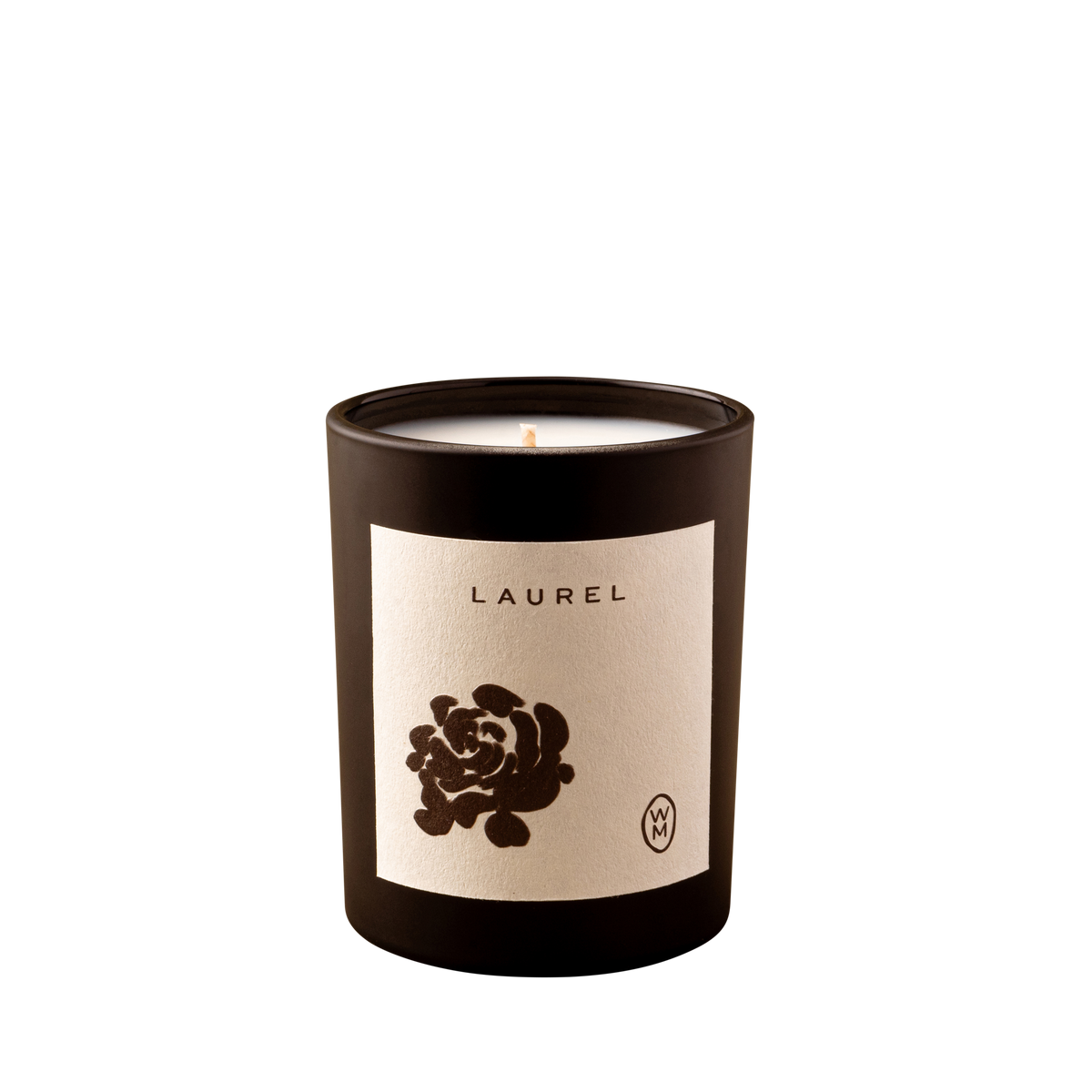 Candle in a black container with a beige label featuring a rose design on a white background