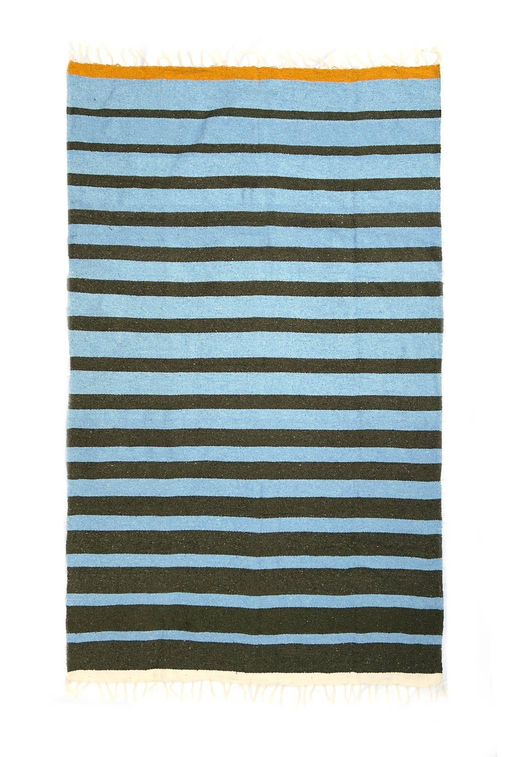 Striped blanket with blue and green stripes on a white background