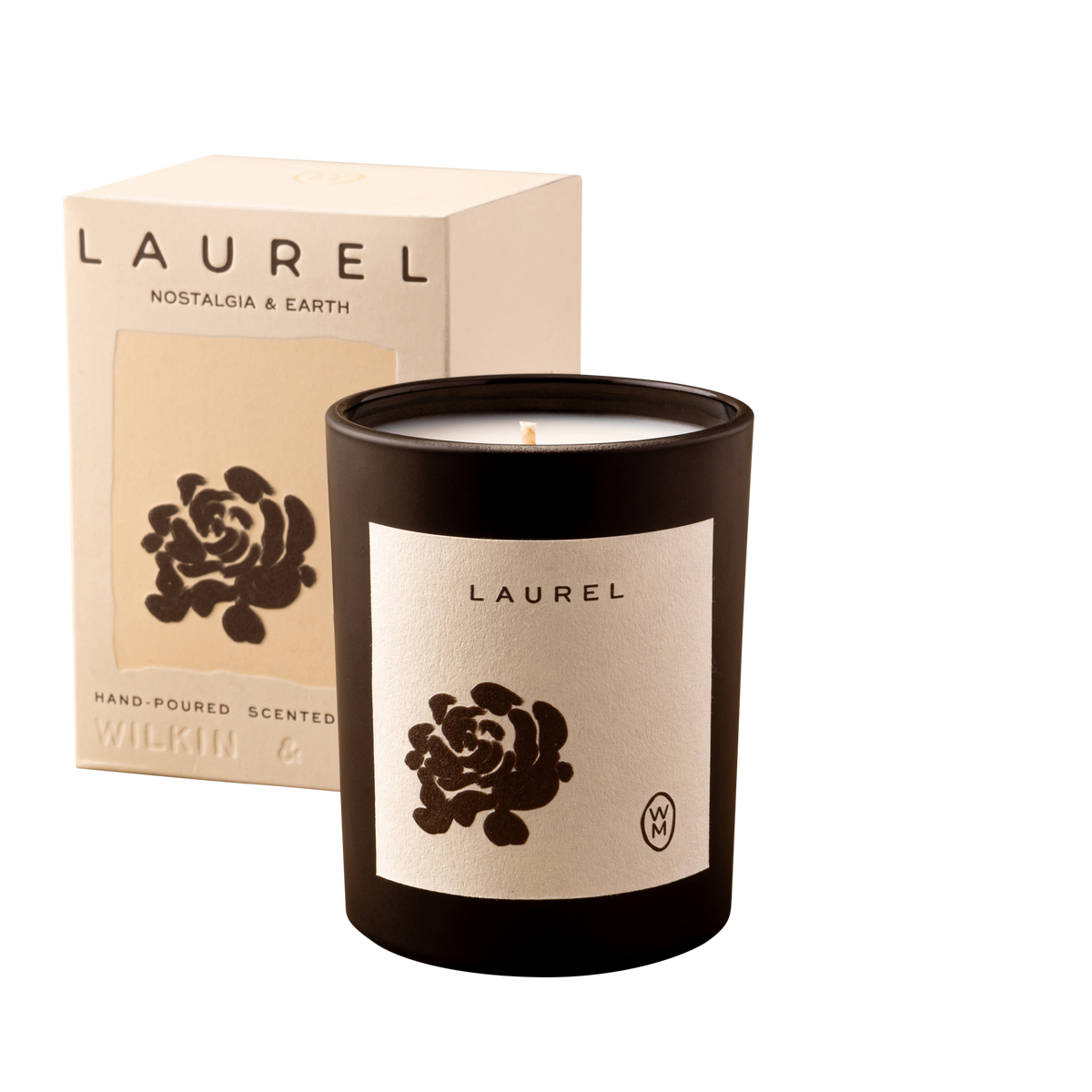 Laurel candle with black lid and beige packaging on a white background